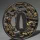Oval openwork iron tsuba with gold inlaid ‘battle … - photo 1 Oval openwork iron tsuba with gold inlaid ‘battle … - photo 1