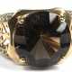 Ring, 585er GG, besetzt mit 1 rund facettierten Rauchquarz, durchbrochen gearbeitete Ringschultern besetzt mit 12 kl. Diamanten, Ges.-Gew. 6,37 g, RG 62 - фото 1 Ring, 585er GG, besetzt mit 1 rund facettierten Rauchquarz, durchbrochen gearbeitete Ringschultern besetzt mit 12 kl. Diamanten, Ges.-Gew. 6,37 g, RG 62 - фото 1
