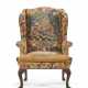 AN IRISH GEORGE II MAHOGANY AND NEEDLEWORK WING ARMCHAIR - photo 1
