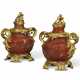 A PAIR OF FRENCH ORMOLU MOUNTED RED JASPER COVERED VASES - photo 1 A PAIR OF FRENCH ORMOLU MOUNTED RED JASPER COVERED VASES - photo 1