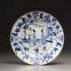 A blue and white plate - photo 1
