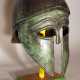 Corinthian bronze helmet in ancient style with open work eyes and nose protection, chased border lines and forehead deocrations - Foto 1