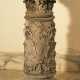 A small stone column with Corinthian capitel and floral sculpted decorations on quadratic plinth - фото 1