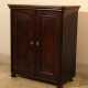 A small miniature armoire with two doors, round corners and on four feet - фото 1