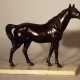 Bronze sculpture of a standing horse looking to the side, on white marble base - фото 1