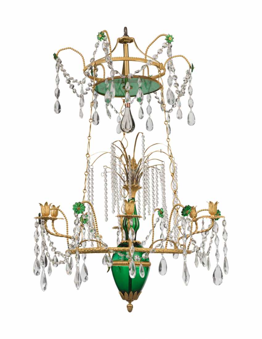 An Edwardian cut and moulded glass and silver plated metal chandelier An Edwardian cut and moulded glass and silver plated metal chandelier