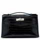 Hermes. A SHINY BLACK ALLIGATOR KELLY POCHETTE WITH PALLADIUM HARDWA... - photo 1