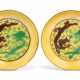 A PAIR OF CHINESE GREEN AND AUBERGINE-ENAMELLED YELLOW-GROUND 'DRAGON' DISHES - photo 1