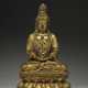 A VERY RARE GILT-BRONZE FIGURE OF SEATED GUANYIN - photo 1