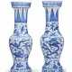 A PAIR OF BLUE AND WHITE TEMPLE VASES - photo 1