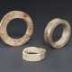 THREE OPAQUE IVORY-COLORED AND CARAMEL-BROWN JADE BRACELETS ... - фото 1