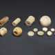 A GROUP OF IVORY AND BUFF-COLORED JADE BEADS AND BUTTONS - фото 1