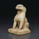 A SMALL WHITE MARBLE FIGURE OF A SEATED LION - фото 1