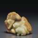 A PALE GREYISH-GREEN AND RUSSET JADE CARVING OF A CAMEL AND ... - фото 1