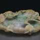 A RUSSET, GREEN AND LAVENDER JADEITE LOTUS LEAF-SHAPED BRUSH... - photo 1