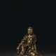 A VERY RARE GILT-BRONZE FIGURE OF WHITE-ROBED GUANYIN - photo 1