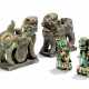 TWO CHINESE BISCUIT-GLAZED FAMILLE VERTE BUDDHIST LIONS AND A PAIR OF POLYCHROME STONE LIONS - фото 1