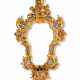 A NORTH ITALIAN REVERSE-CUT-MIRROR-MOUNTED GILTWOOD CARTOUCHE-SHAPED FRAME - фото 1
