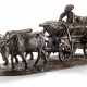 A BRONZE MODEL OF A CHUMAK RIDING ON AN OXCART - Foto 1
