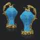 A PAIR OF FRENCH ORMOLU-MOUNTED CHINESE TURQUOISE-GLAZED PORCELAIN TWIN-CARP EWERS - photo 1