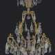 A FRENCH ORMOLU AND ROCK CRYSTAL TWELVE-LIGHT CHANDELIER - photo 1