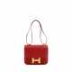 HERMÈS. A ROUGE CASAQUE EPSOM LEATHER CONSTANCE 23 WITH GOLD HARDWARE - Foto 1