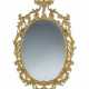 A GEORGE III CARVED GILTWOOD MIRROR - photo 1
