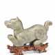 A GREYISH-GREEN CARVED JADE FIGURE OF A DOG - photo 1