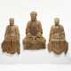 A GROUP OF THREE LARGE CARVED WOOD BUDDHIST FIGURES - фото 1