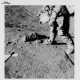 Views of David Scott during geological investigations; TV picture, station 7; the lunar tongs set against a big boulder, station 4, July 26-August 7, 1971, EVA 2 - Foto 1