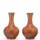 A RARE PAIR OF GILT-DECORATED CORAL-GROUND BOTTLE VASES - фото 1