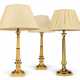 THREE GILT-LACQUERED BRONZE TABLE LAMPS - Foto 1