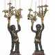 A LARGE PAIR OF FRENCH ORMOLU, PATINATED AND PARCEL-GILT BRONZE AND ROUGE GRIOTTE MARBLE FIGURAL FIVE-LIGHT CANDELABRA - фото 1