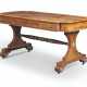 McLean, John. A REGENCY BRASS-MOUNTED BRAZILIAN ROSEWOOD AND SATINWOOD-CROSSBANDED WRITING-TABLE - Foto 1