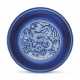 A RARE RESERVE-DECORATED BLUE AND WHITE ‘DRAGON’ DISH - photo 1