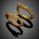 Lot comprising two gilt metal snake bangles with snap clasps accented with rubies and emeralds - photo 1