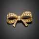 Yellow gold round and tapered diamond bow brooch in all ct. 3.50 circa - photo 1