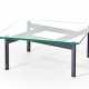 Coffee table with black painted aluminum legs connected by crosspieces and very thick glass top - фото 1