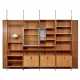 Michele Achilli, Daniele Brigidini e Guido Canella. Bookcase in veneered wood and solid walnut with four spans, lower part with door cabinets and brass handles, upper part with open shelves and display cabinet - фото 1