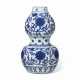 A BLUE AND WHITE DOUBLE-GOURD `LOTUS` VASE - photo 1