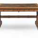A GOTHIC REVIVAL OAK WRITING TABLE - photo 1