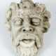 Stone Head of a man with open mouth and beard - photo 1