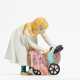 Porcelain figurine of girl with a doll's pram - photo 1