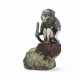 A SILVER TABLE LIGHTER IN THE FORM OF A SEATED BABOON - photo 1