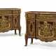 A PAIR OF FRENCH ORMOLU-MOUNTED PLUM-PUDDING MAHOGANY COMMODES AUX VANTAUX - photo 1