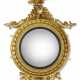 A CLASSICAL EAGLE-CARVED GILTWOOD CONVEX MIRROR - Foto 1