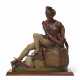 A MOLDED ZINC POLYCHROME PAINT-DECORATED CIGAR STORE FIGURE OF A `SITTING INDIAN` - Foto 1