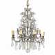 A CONTINENTAL BRONZE, CUT AND MOULDED GLASS EIGHT-LIGHT CHANDELIER - Foto 1