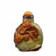 A CARVED RUSSET AND GREEN JADE SNUFF BOTTLE - фото 1