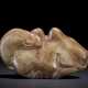 A LARGE GREENISH-BROWN JADE CARVING OF A CAMEL - Foto 1
